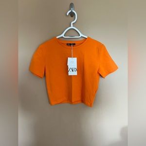 Size small orange Zara crop. Never worn.